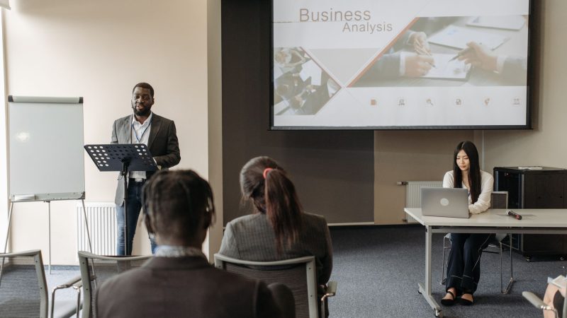 Business seminar with a speaker and audience in a conference room. — Reliable High Risk Merchant Account for Stable Business 