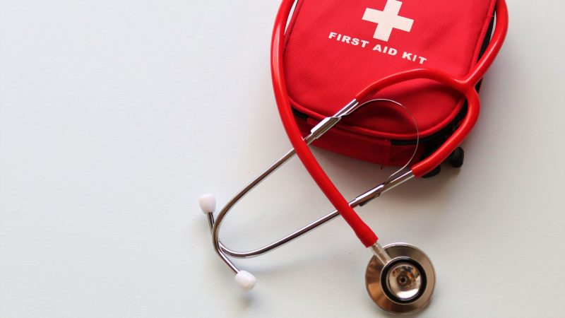 A red first aid kit paired with a stethoscope, signifying healthcare and medical treatment essentials. — The Benefits of Usin